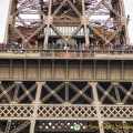 People on the Eiffel Tower as seen from the Quai Branly Museum